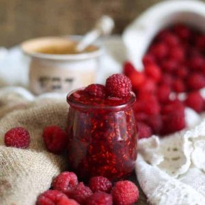 Clean raspberry preserves with honey