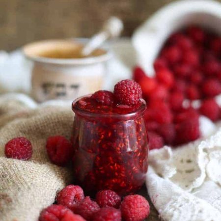 Clean raspberry preserves with honey